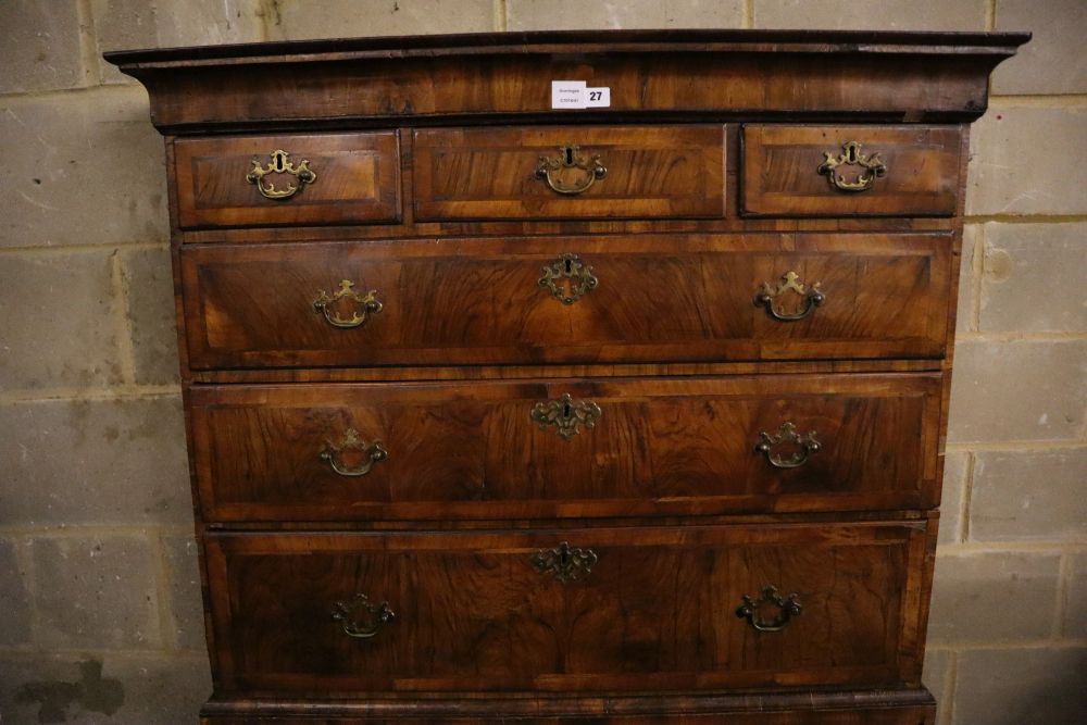 An early 18th century banded walnut tallboy, with oak sides, width 108cm depth 55cm height 180cm